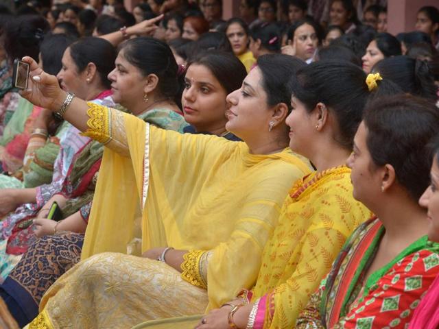 A school teacher takes a selfie during celebrations for 'Teacher's Day' at a school in Amritsar on September 5. September 5, is the birth anniversary of former President Sarvapalli Radhakrishnan, an influential scholar in comparative religion and philosophy, and is celebrated as Teachers' Day .(AFP)