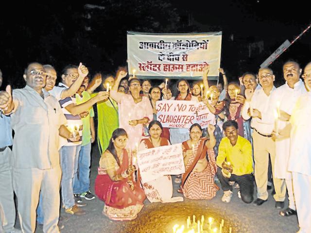 Residents of Green Medows colony protest against the state government’s proposal to mark a new site for a slaughterhouse in Bhopal on Sunday. (Mujeeb Faruqui/ HT photo) Residents of Green Medows colony protest against the state government’s proposal to mark a new site for a slaughterhouse in Bhopal on Sunday. (Mujeeb Faruqui/ HT photo)