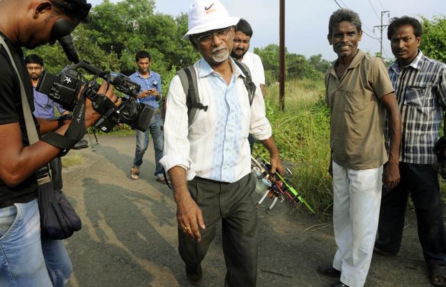 State government official (in white shirt) carrying small drone to Singur to speed up the land survey process. (Ashok Nath Dey) State government official (in white shirt) carrying small drone to Singur to speed up the land survey process. (Ashok Nath Dey)