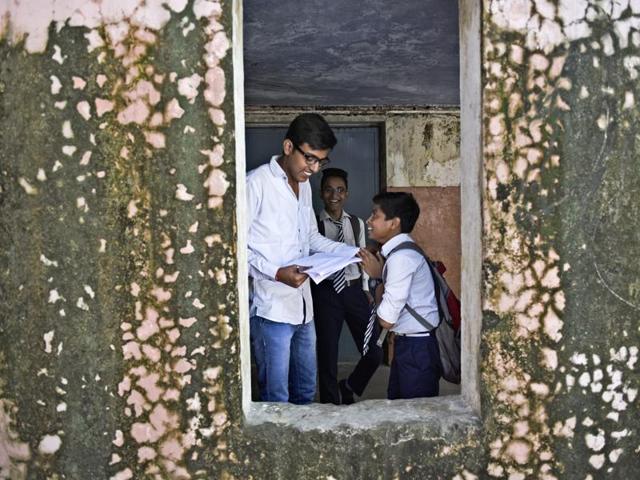 Student Amit Singh, left, acts as school principal as students celebrate Teachers' Day at Shaheed Hemu Kalani Sarvodaya Bal Vidhyalaya School at Lajpat Nagar in New Delhi on Monday. (Ravi Choudhary/HT PHOTO)