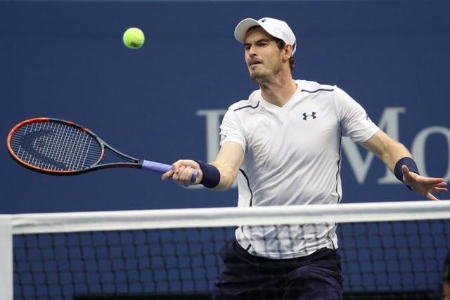 Andy Murray hits a volley against Paolo Lorenzi of Italy. (AFP Photo) Andy Murray hits a volley against Paolo Lorenzi of Italy. (AFP Photo)