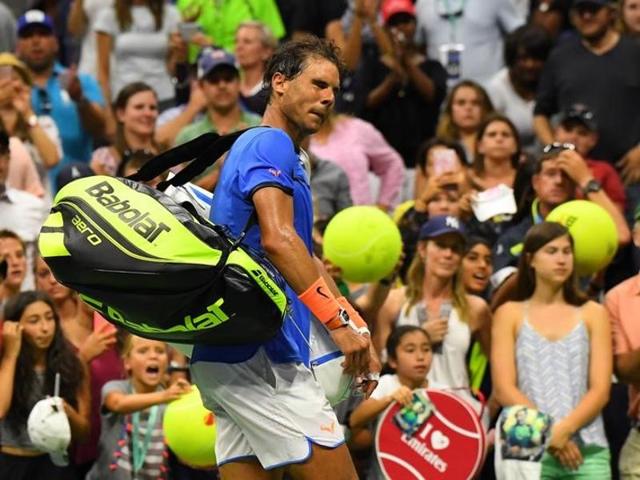 Nadal leaves Arthur Ashe stadium after his loss to Pouille. (Reuters)
