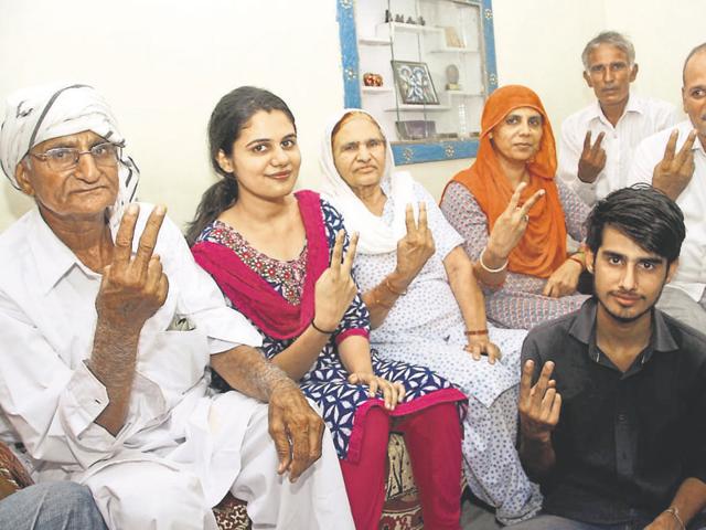 Shweta Suhag, who topped the Haryana Civil Services (executive) examination, with her family at their residence in Rohtak. (Manoj Dhaka/HT) Shweta Suhag, who topped the Haryana Civil Services (executive) examination, with her family at their residence in Rohtak. (Manoj Dhaka/HT)