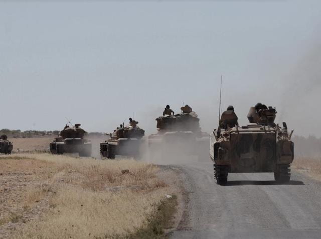 Turkish tanks head to the Syrian border, in Karkamis, Turkey. Turkish troops and allied Syrian rebels expelled the IS from Syrian-Turkish border. (AP Photo) Turkish tanks head to the Syrian border, in Karkamis, Turkey. Turkish troops and allied Syrian rebels expelled the IS from Syrian-Turkish border. (AP Photo)
