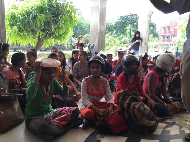 Daulat Ram College students are protesting after a piece of the ceiling fell off in a classroom, injuring five students. (Nikita Saxena/HT)