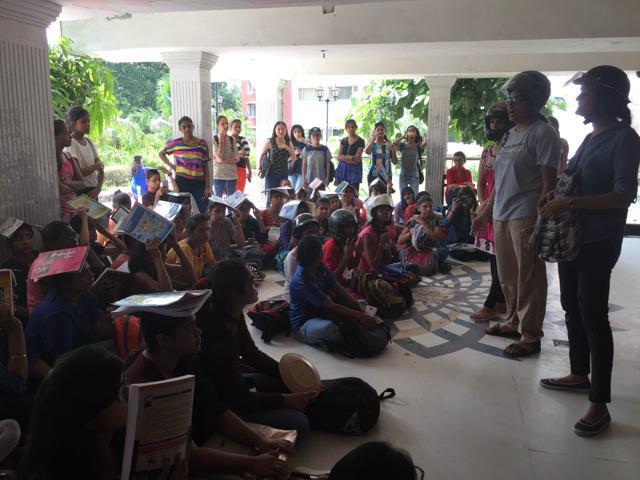The students are registering their anger with the authorities over poor infrastructure in college by wearing helmets and covering their heads with plates. (Nikita Saxena/HT)