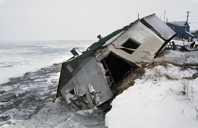 An abandoned house in Alaska sits on the beach after sliding off during a fall storm. (AP File Photo) An abandoned house in Alaska sits on the beach after sliding off during a fall storm. (AP File Photo)