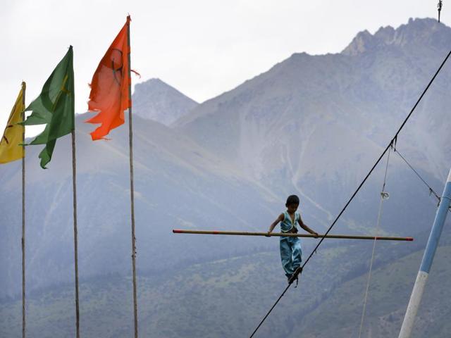 A boy performs a tight-rope walk during the second World Nomad Games. (AP photo)