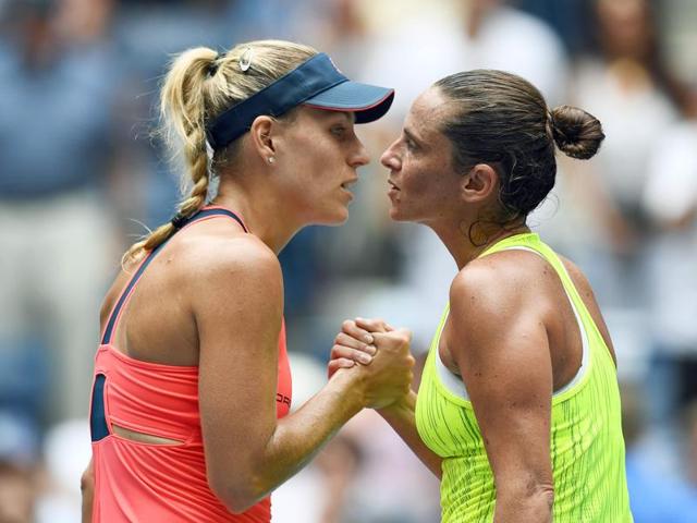 Kerber and Vinci embrace at the net after the match. (AFP)