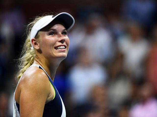 Caroline Wozniacki of Denmark celebrates defeating Anastasija Sevastova of Latvia. (AFP)