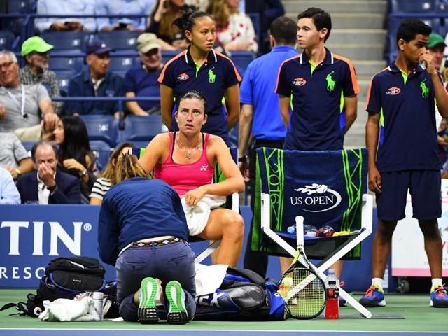 Sevastova receives treatment during a medical timeout. After falling and twisting her ankle, the Latvian couldn’t get back into the match. (AFP)