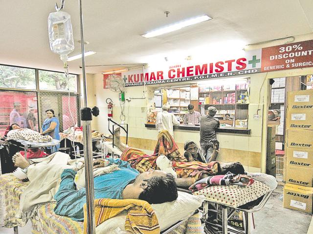 Patients lying on stretchers next to a chemist shop at the PGI advanced trauma centre in Chandigarh on Tuesday. (Ravi Kumar/HT) Patients lying on stretchers next to a chemist shop at the PGI advanced trauma centre in Chandigarh on Tuesday. (Ravi Kumar/HT)