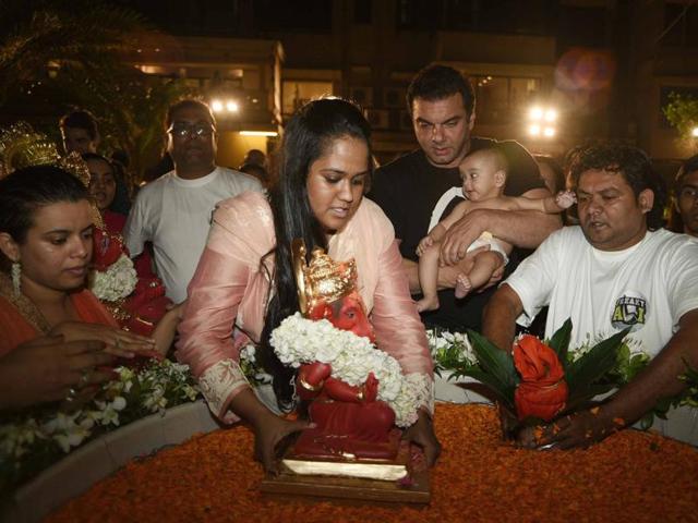 Arpita Khan Sharma immerses the idol of Ganesha as brother Sohail holds her son. The family celebrated Ganesha festival this year without Salman Khan because the actor is currently in Manali shooting for Kabir Khan’s Tubelight. (Yogen Shah)
