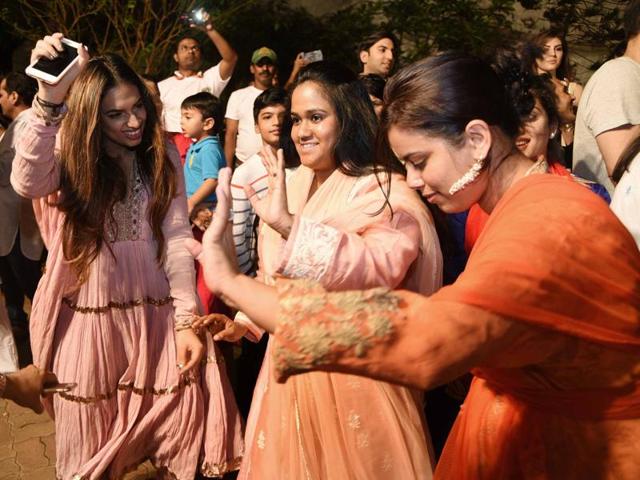 Arpita Khan dances during a procession for immersion of Ganpati idol in Mumbai. (Yogen Shah)
