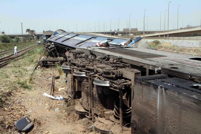 A general view shows the wreckage of a train after it derailed near the village of Al-Ayyat in Giza. (AFP Photo)