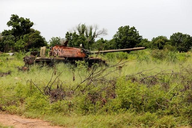 An abandoned tank is seen in a field in Bama, Borno State, Nigeria. (Reuters) An abandoned tank is seen in a field in Bama, Borno State, Nigeria. (Reuters)