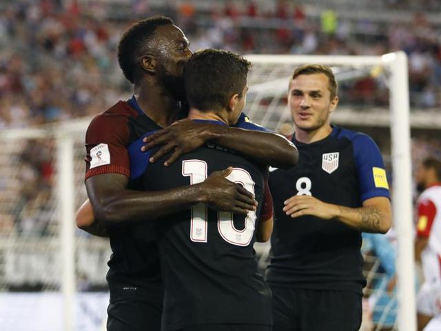 United States forward Jozy Alitdore (17) and midfielder Christian Pulisic (10) celebrate after a goal. (Reuters)