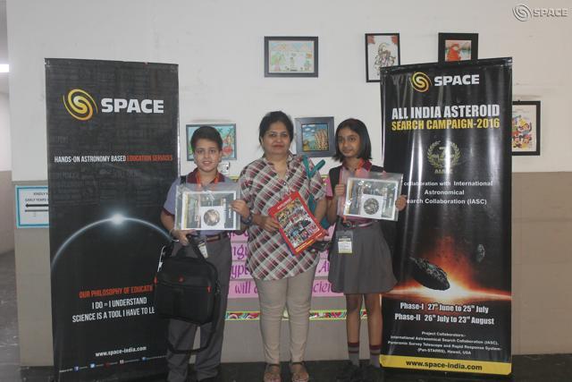 Gurgaon students Pravesh Narang and Mihika Agarwal along with their school teacher.