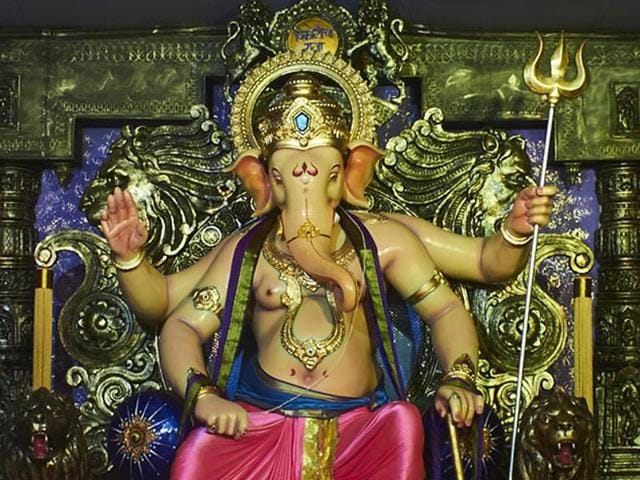 Some of the images that surround the 14-foot Ganesha idol display information about the international pothole day, how most injuries in the human body are felt on the spine, a model of a pothole-free road and the progression of pothole deaths in the state from 2011 to 2015. (HT Photo) Some of the images that surround the 14-foot Ganesha idol display information about the international pothole day, how most injuries in the human body are felt on the spine, a model of a pothole-free road and the progression of pothole deaths in the state from 2011 to 2015. (HT Photo)