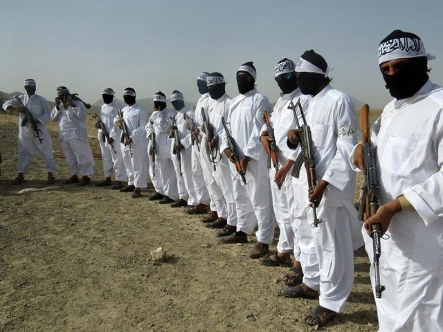 In this August 15, 2016 photo, Taliban suicide bombers stand guard during a gathering of a breakaway Taliban faction, in the border area of Zabul province, Afghanistan. (AP) In this August 15, 2016 photo, Taliban suicide bombers stand guard during a gathering of a breakaway Taliban faction, in the border area of Zabul province, Afghanistan. (AP)