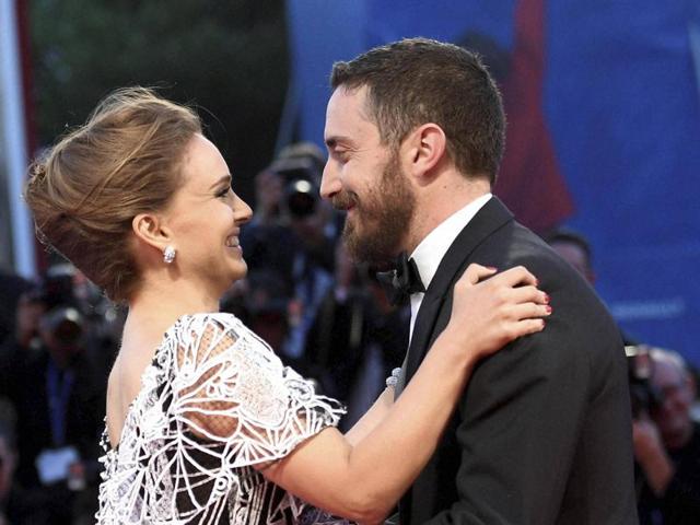 Actress Natalie Portman, left, and director Pablo Larrain (right) hug each other upon their arrival on the red carpet for the premiere of the movie 'Jackie' during the 73rd Venice Film Festival. (AP)