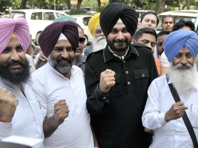 “There is a tradition in India that good people are kept as decoration pieces and used only for campaigning… Awaaz-e-Punjab is a revolutionary voice,” Sidhu said. He also attacked the ruling Badal family, which he held responsible for putting the state in “dire straits”. Seen here are, from left, Independent MLA Simarjeet Singh Bains, MLA and suspended SAD leader Pargat Singh, Sidhu, and Simarjeet’s brother and MLA Balwinder Singh Bains. (Ravi Kumar/HT Photo)