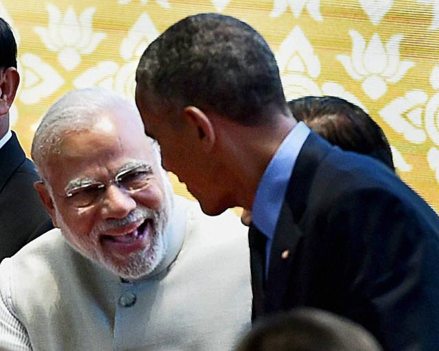 Vientiane: Prime Minister Narendra Modi and US President Barack Obama greet each other during the group photo session at the 11th East Asia summit in Vientiane, Laos on Thursday. PTI Photo by Vijay VermaB(PTI9_8_2016_000081B) (PTI) 