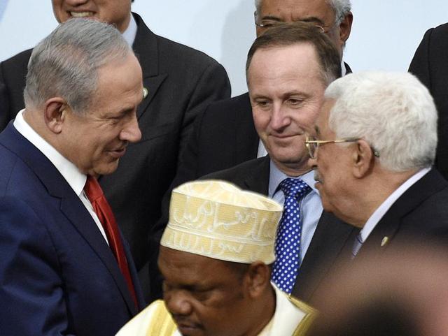 In this November 30, 2015 file photo, Israeli Prime Minister Benjamin Netanyahu, left, talks with Palestinian President Mahmoud Abbas, right, at the COP21, the United Nations Climate Change Conference, in Le Bourget, outside Paris. (AP) In this November 30, 2015 file photo, Israeli Prime Minister Benjamin Netanyahu, left, talks with Palestinian President Mahmoud Abbas, right, at the COP21, the United Nations Climate Change Conference, in Le Bourget, outside Paris. (AP)