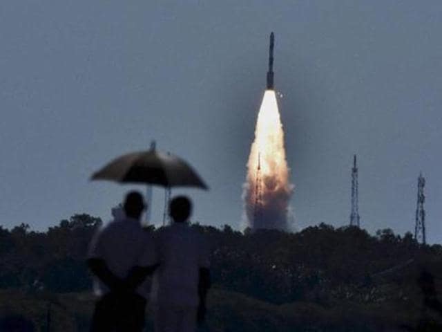 People look at PSLV C-34 rocket as it propels into sky after being launched from the Satish Dhawan Space Centre at Sriharikota.(PTI Photo)