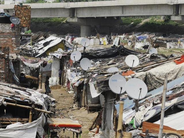 A scene in a slum in Lucknow where almost every house has dish TV connection(Deepak Gupta/HT photo) A scene in a slum in Lucknow where almost every house has dish TV connection(Deepak Gupta/HT photo)