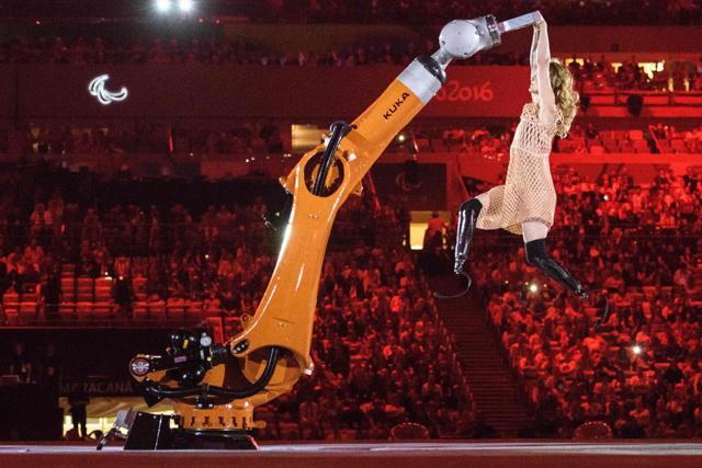 The ceremony had American Paralympic snowboarder Amy Purdy dancing with a robot. (AFP) The ceremony had American Paralympic snowboarder Amy Purdy dancing with a robot. (AFP)