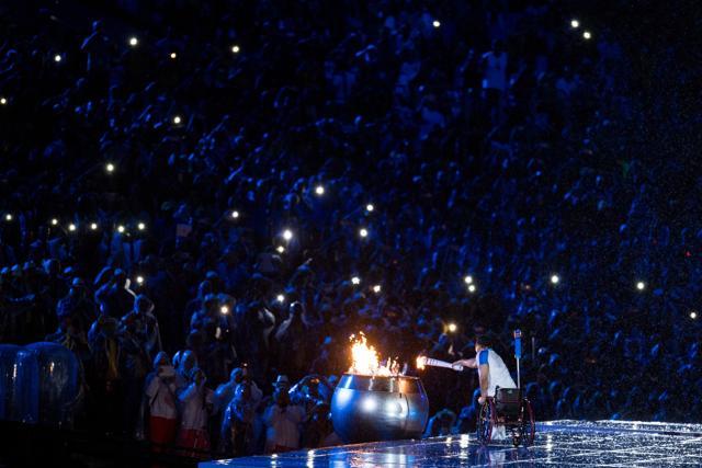 Brazilian athlete Clodoaldo da Silva lights the cauldron. (AP) Brazilian athlete Clodoaldo da Silva lights the cauldron. (AP)