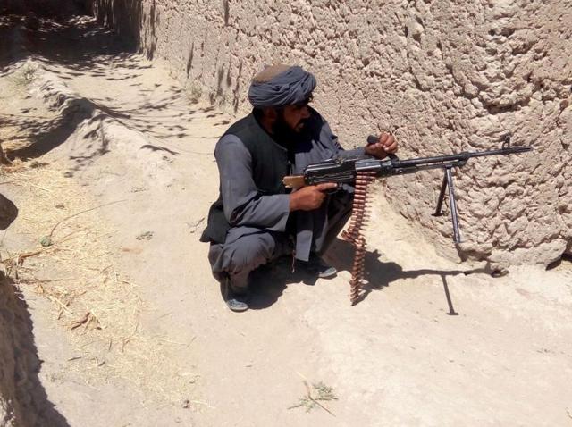 An Afghan soldier patrols during ongoing fighting with the Taliban in Tarin Kot district of Uruzgan province on Thursday. The Taliban stormed Tarin Kot, triggering heavy fighting around government buildings as panicked residents scrambled to flee the capital of southern Uruzgan province. (AFP) An Afghan soldier patrols during ongoing fighting with the Taliban in Tarin Kot district of Uruzgan province on Thursday. The Taliban stormed Tarin Kot, triggering heavy fighting around government buildings as panicked residents scrambled to flee the capital of southern Uruzgan province. (AFP)