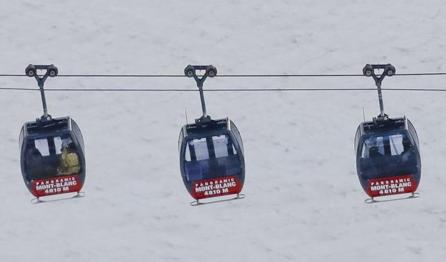 Aerial view of three cars of the Panoramic Mont Blanc cable car where tourists were trapped after it stalled around 4 pm on Thursday, when its cables reportedly tangled. (AP) Aerial view of three cars of the Panoramic Mont Blanc cable car where tourists were trapped after it stalled around 4 pm on Thursday, when its cables reportedly tangled. (AP)