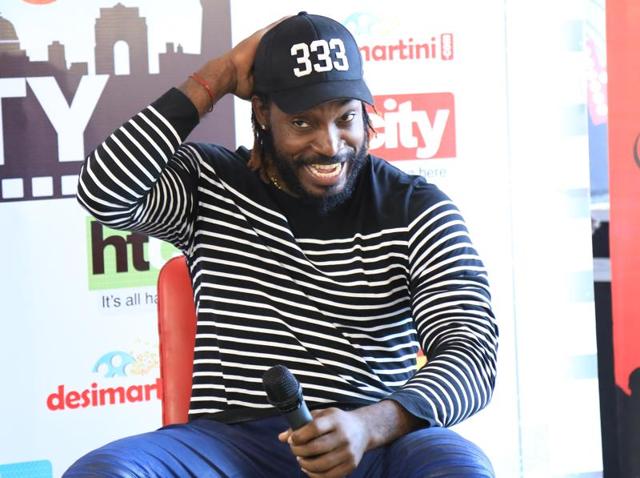 Jamiaca-born cricketer Chris Gayle visited HT House on Friday to meet the winners of HT City Stars in the City Contest and to promote his new book, Six Machine. (Zabeeh Afaque/HT Photo ) 