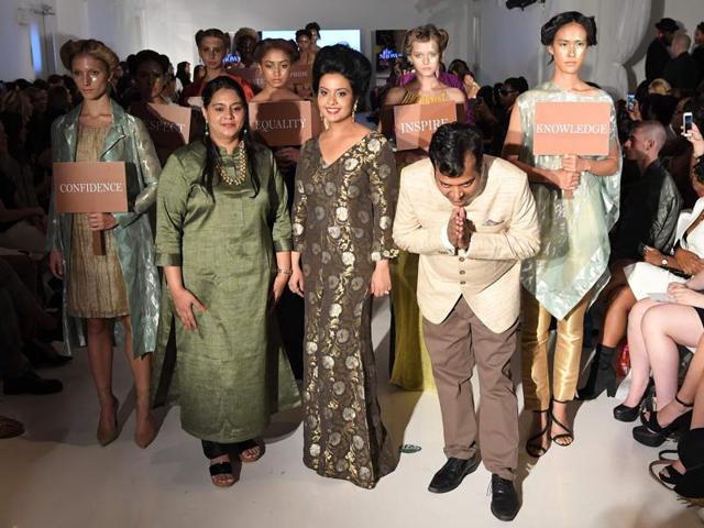 Amruta sported a unique Indo-western wear in handloom designed by students of Pune-based institute Chasa Institute of Design and Technology, who are mainly children of farmers and porters. (AFP) 