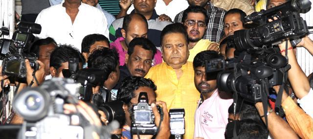 File photo of Madan Mitra (in yellow kurta) being discharged from SSKM hospital on November 1, 2015 after he was granted bail from Alipore Court 324 days after arrest. (Samir Jana) File photo of Madan Mitra (in yellow kurta) being discharged from SSKM hospital on November 1, 2015 after he was granted bail from Alipore Court 324 days after arrest. (Samir Jana)