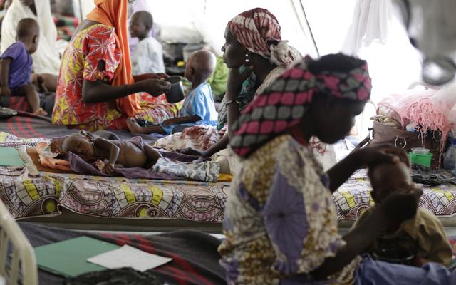 Women feed their malnourished children at a feeding centre run by Doctors Without Borders in Maiduguri, Nigeria. (AP) Women feed their malnourished children at a feeding centre run by Doctors Without Borders in Maiduguri, Nigeria. (AP)