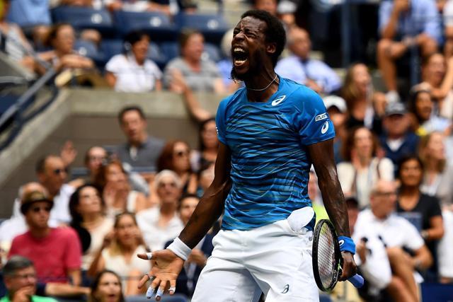 Monfils celebrates winning the third set. (AFP) Monfils celebrates winning the third set. (AFP)