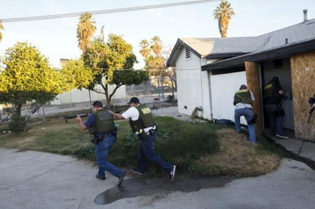 Law enforcement officers search for the suspects of a mass shooting December 2, 2015 in San Bernardino, California. (AFP File) Law enforcement officers search for the suspects of a mass shooting December 2, 2015 in San Bernardino, California. (AFP File)