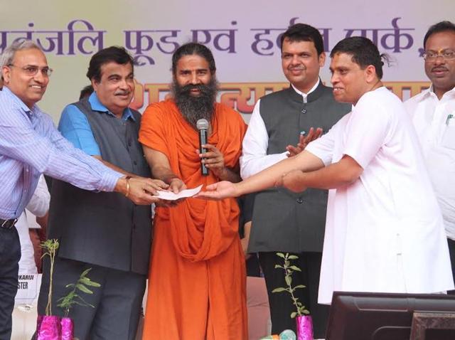 Union minister Nitin Gadkari, Baba Ramdev and chief minister Devendra Fadnavis at the launch of Patanjali food park (Sunny Shende/HT photo) Union minister Nitin Gadkari, Baba Ramdev and chief minister Devendra Fadnavis at the launch of Patanjali food park (Sunny Shende/HT photo)