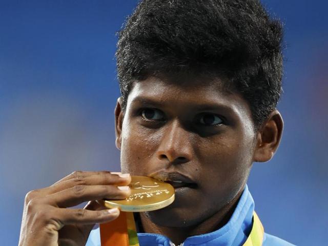 Mariyappan Thangavelu (L) and Varun Singh Bhati celebrate their gold and bronze medals, respectively.(AFP)