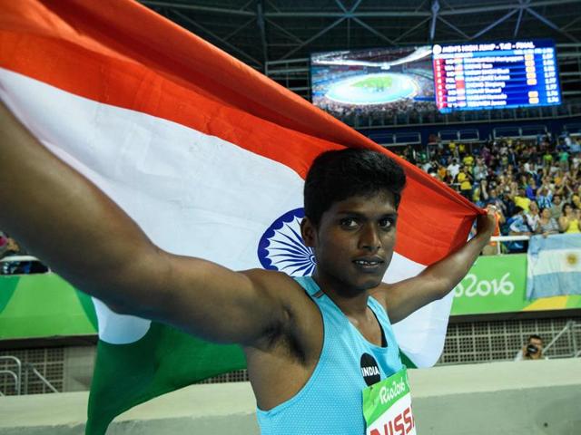 Mariyappan Thangavelu (L) and Varun Singh Bhati celebrate their gold and bronze medals, respectively.(AFP)