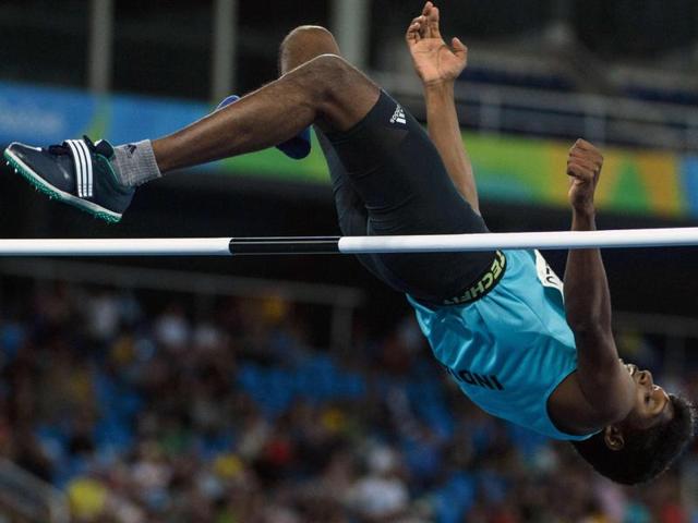 India's Mariyappan Thangavelu jumps in the men's final high jump - T42 during the Paralympic Games at the Olympic Stadium in Rio de Janeiro on September 9, 2016.  (AFP) 