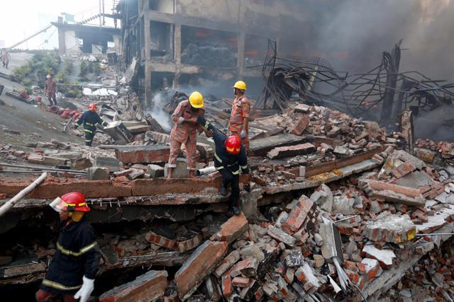 Rescue personnel work at the site of a fire in Tongi industrial area outside Dhaka. (AP) Rescue personnel work at the site of a fire in Tongi industrial area outside Dhaka. (AP)