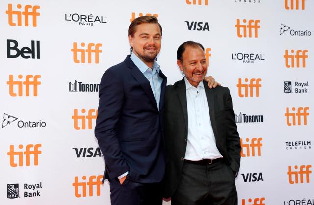 Leonardo DiCaprio arrives on the red carpet with Fisher Stevens (R) for the film Before the Flood during the 41st Toronto International Film Festival (TIFF), in Toronto. (REUTERS)