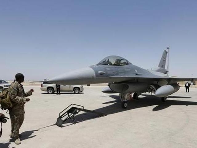 US army soldiers look at a F-16 fighter jet during an official ceremony in Balad, Iraq, in July 2015. Pentagon recently backed a proposal by manufacturing companies to produce fighter jets under the ‘Make in India’ initiative. (Reuters) US army soldiers look at a F-16 fighter jet during an official ceremony in Balad, Iraq, in July 2015. Pentagon recently backed a proposal by manufacturing companies to produce fighter jets under the ‘Make in India’ initiative. (Reuters)
