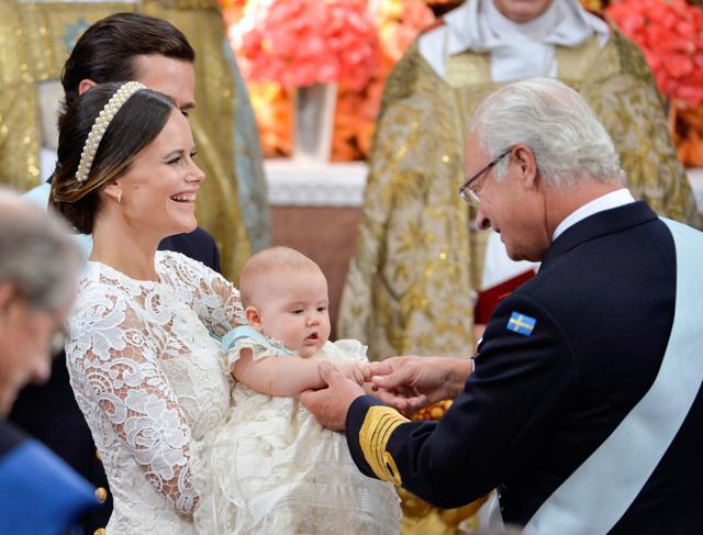 Princess Sofia holds up Prince Alexander for King Carl Gustaf during her son's christening at the Palace Chapel of the Drottningholm Palace, Stockholm. (REUTERS) Princess Sofia holds up Prince Alexander for King Carl Gustaf during her son's christening at the Palace Chapel of the Drottningholm Palace, Stockholm. (REUTERS)