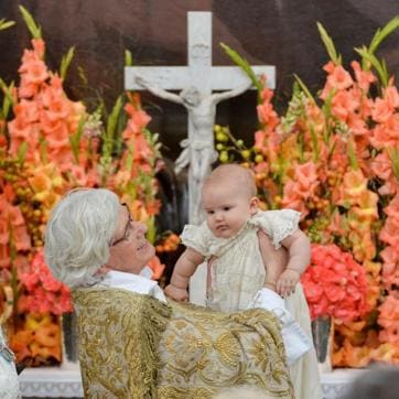 Arch Bishop Antje Jackelen holds up Prince Alexander at Palace Chapel in Drottningholm Palace in Stockholm during the christening of the five month-old Prince. (AFP) Arch Bishop Antje Jackelen holds up Prince Alexander at Palace Chapel in Drottningholm Palace in Stockholm during the christening of the five month-old Prince. (AFP)