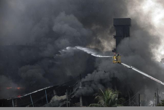 Bangladeshi firefighters work to put out a huge fire at the site of an explosion in a factory in the key Bangladeshi garment manufacturing town of Tongi. (AFP) Bangladeshi firefighters work to put out a huge fire at the site of an explosion in a factory in the key Bangladeshi garment manufacturing town of Tongi. (AFP)